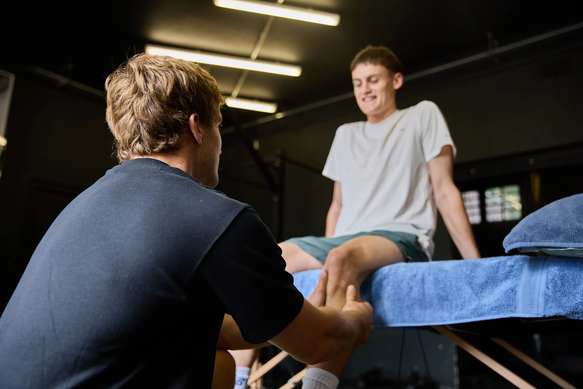 Felix treating a client's leg on the table
